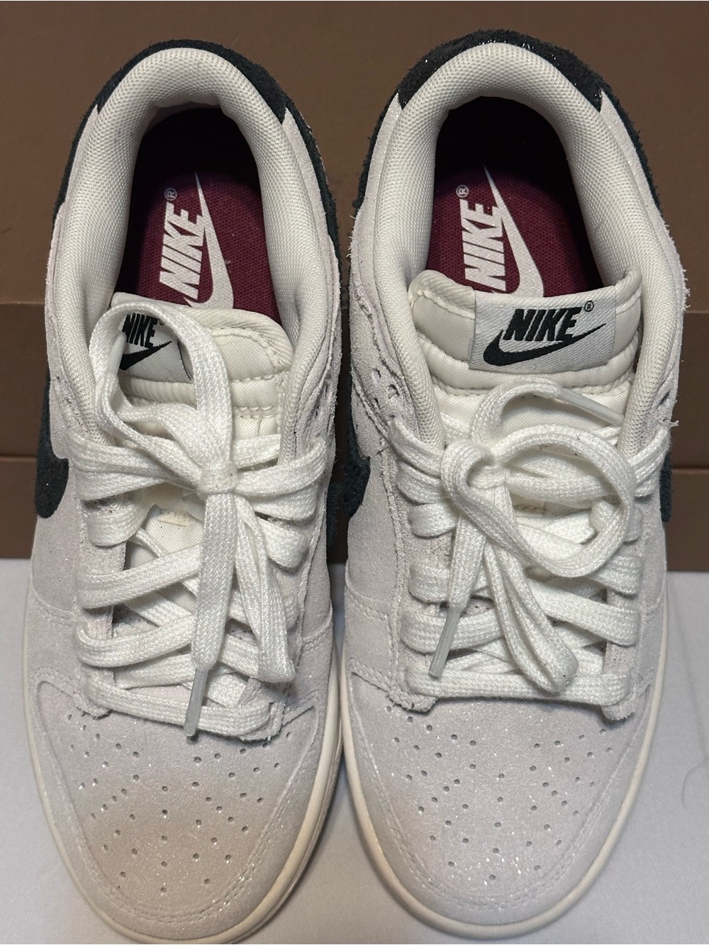 Nike White Low-Top Sneakers with Black Swoosh and Maroon Insole